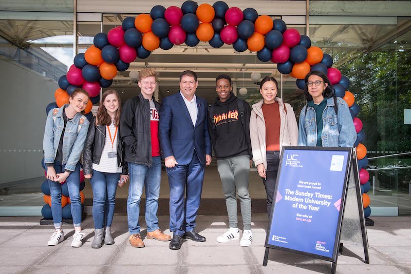 Professsor Bashir Makhoul and students celebrate being named Modern University of the Year